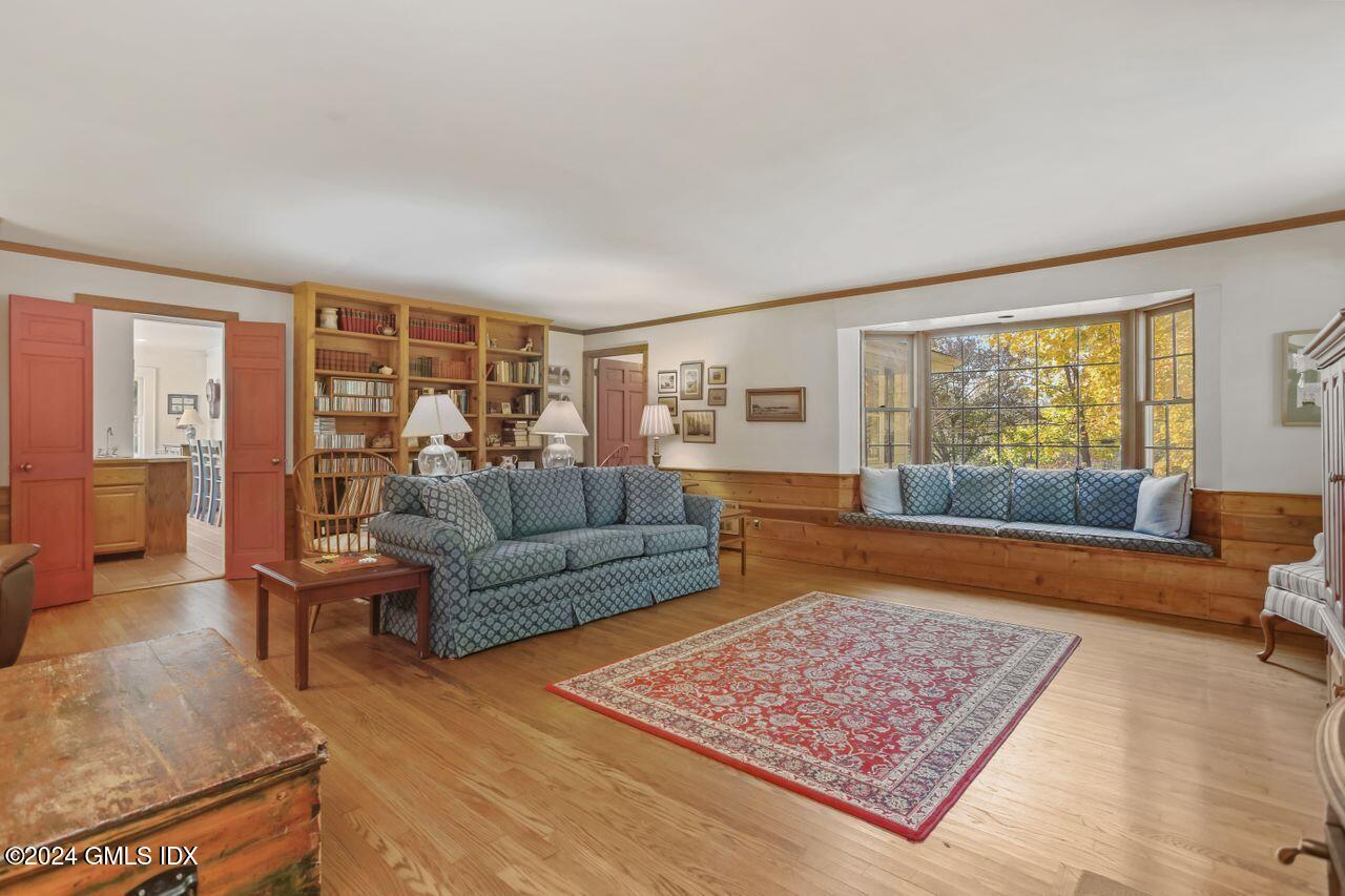 242 Taconic Road Greenwich, CT 06831 - Photo 12 of 37 a living room with furniture and a rug