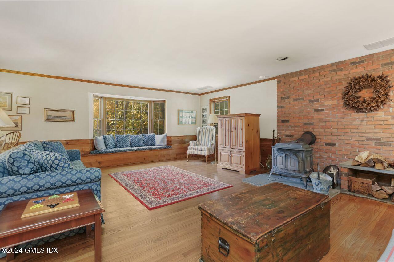 242 Taconic Road Greenwich, CT 06831 - Photo 13 of 37 a living room with furniture and a flat screen tv