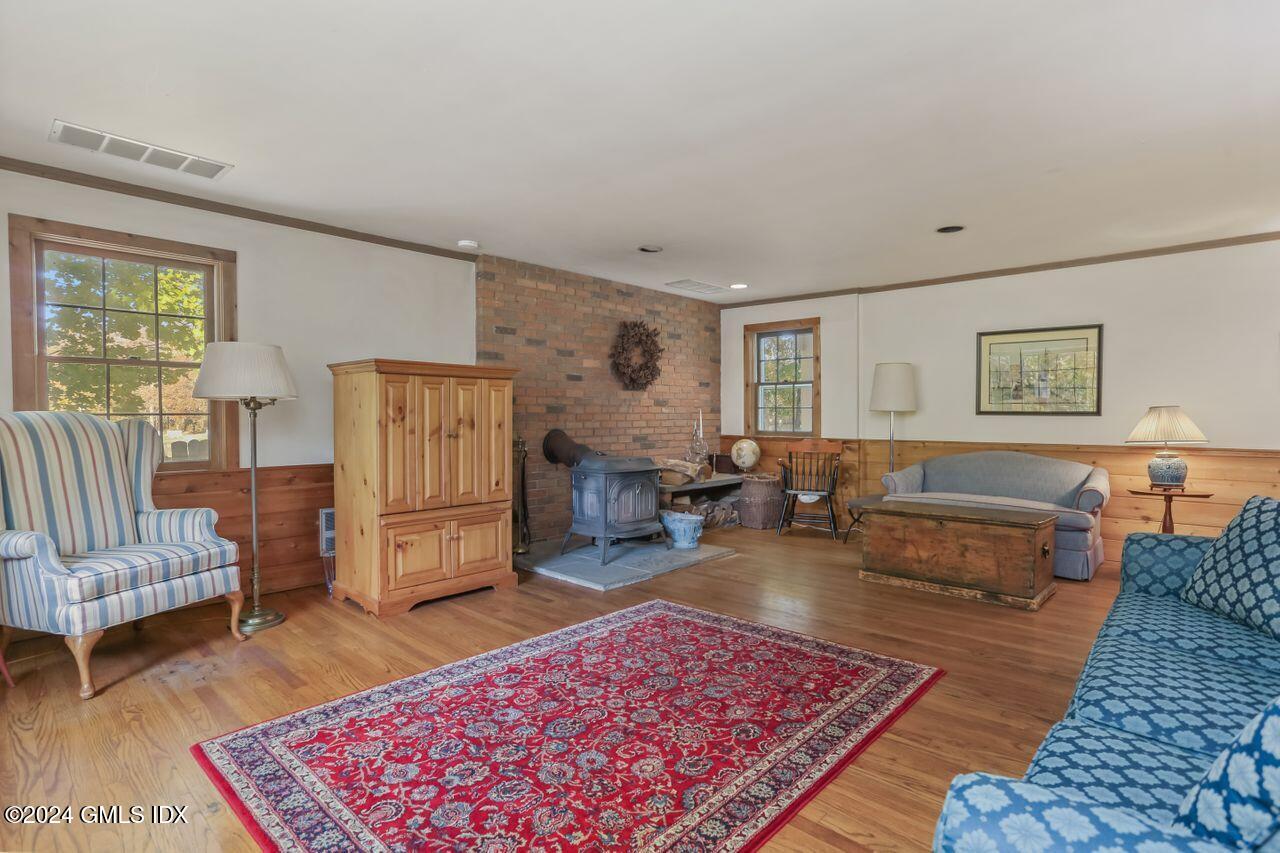 242 Taconic Road Greenwich, CT 06831 - Photo 14 of 37 a living room with furniture and a rug