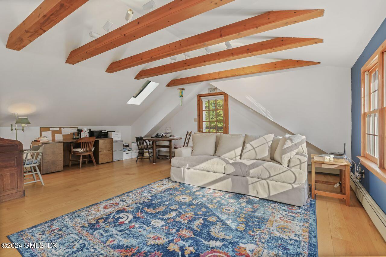 242 Taconic Road Greenwich, CT 06831 - Photo 15 of 37 a living room with furniture and a wooden floor