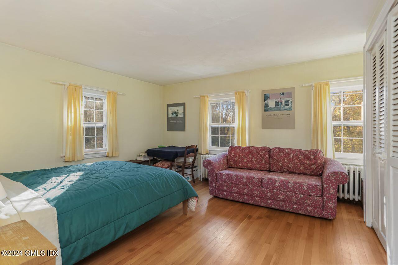 242 Taconic Road Greenwich, CT 06831 - Photo 25 of 37 a bedroom with two beds and a couch