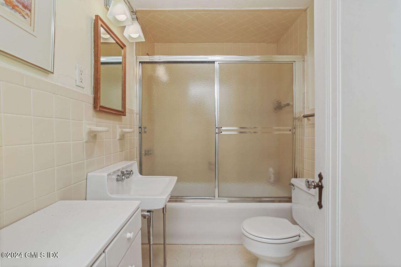242 Taconic Road Greenwich, CT 06831 - Photo 26 of 37 a bathroom with a sink toilet and shower