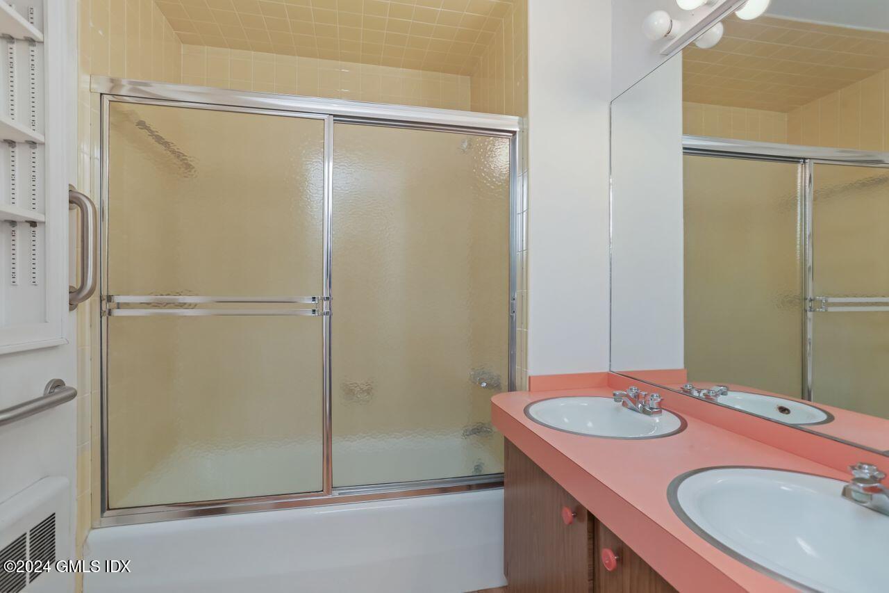 242 Taconic Road Greenwich, CT 06831 - Photo 27 of 37 a bathroom with a sink and shower