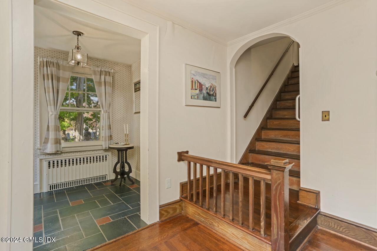 242 Taconic Road Greenwich, CT 06831 - Photo 4 of 37 a view of a hallway with entryway and chandelier