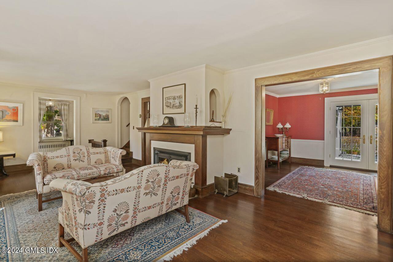 242 Taconic Road Greenwich, CT 06831 - Photo 6 of 37 a living room with furniture and a fireplace