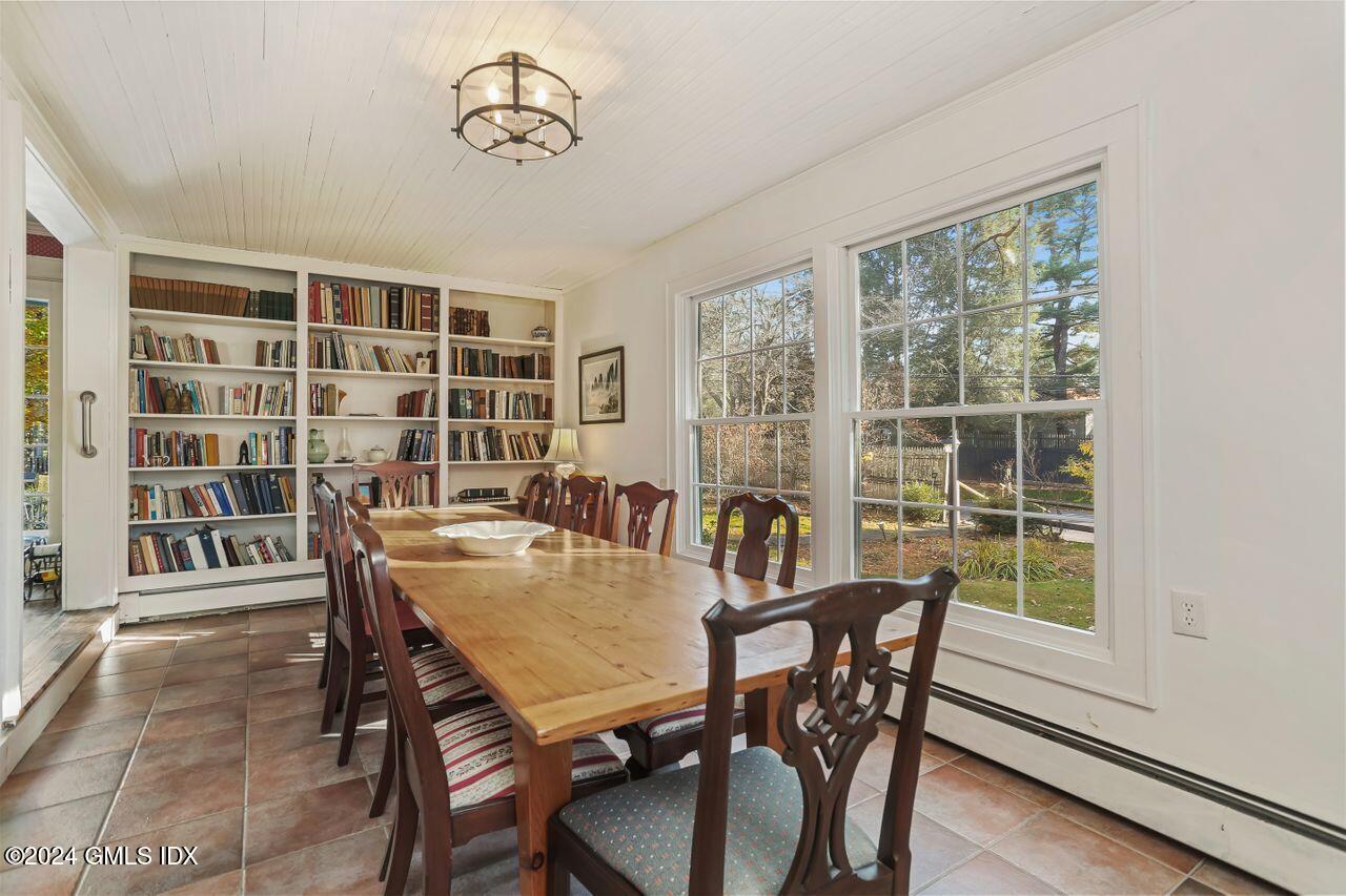 242 Taconic Road Greenwich, CT 06831 - Photo 9 of 37 a view of a dining room with furniture window and wooden floor