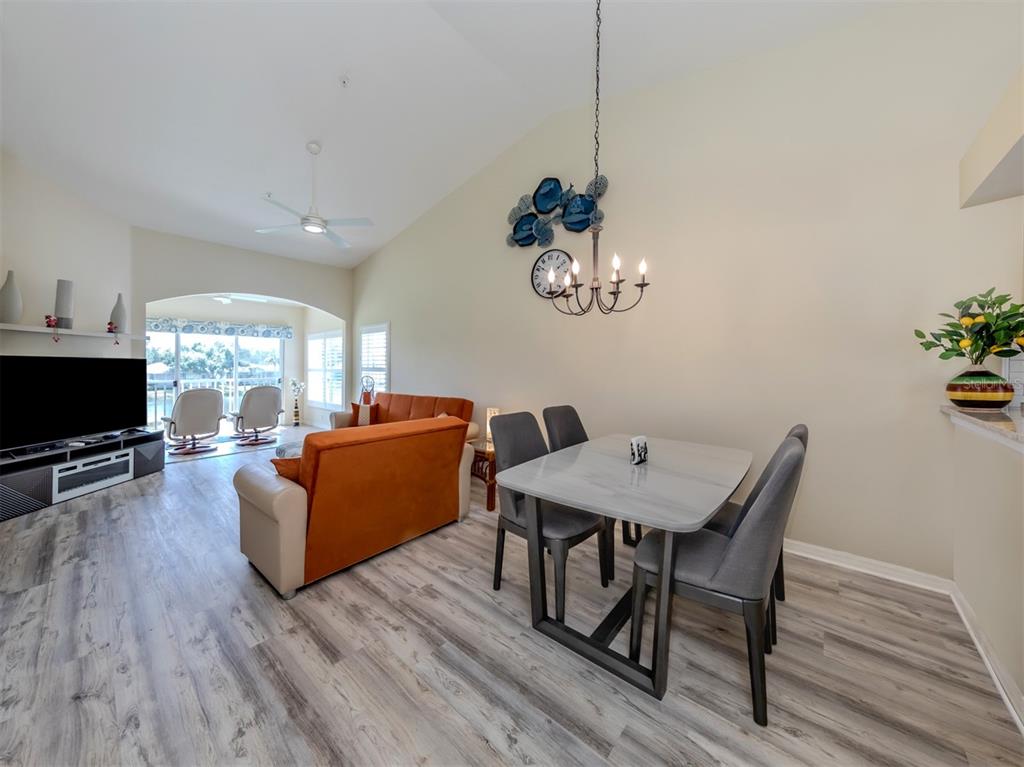 901 Addington Court, Unit 203 Venice, FL 34293 - Photo 13 of 61 a view of a livingroom with furniture and a flat screen tv