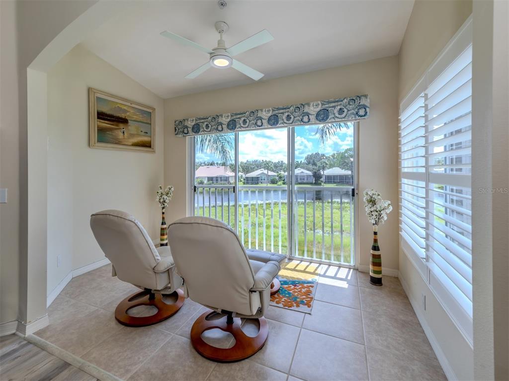 901 Addington Court, Unit 203 Venice, FL 34293 - Photo 22 of 61 a view of a workspace with furniture and a window