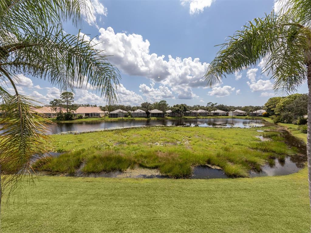 901 Addington Court, Unit 203 Venice, FL 34293 - Photo 23 of 61 a view of a ocean with a big yard