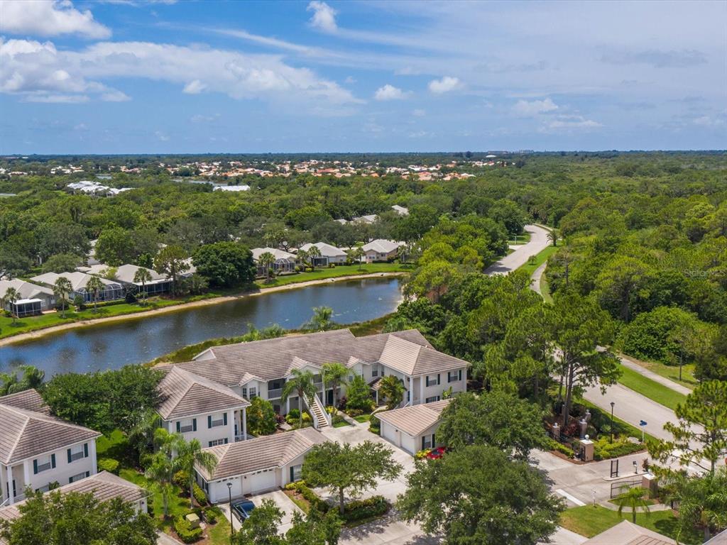 901 Addington Court, Unit 203 Venice, FL 34293 - Photo 33 of 61 an aerial view of residential houses with outdoor space and lake view