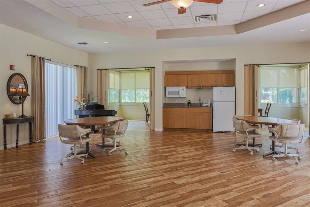 901 Addington Court, Unit 203 Venice, FL 34293 - Photo 41 of 61 a living room with furniture and a large window