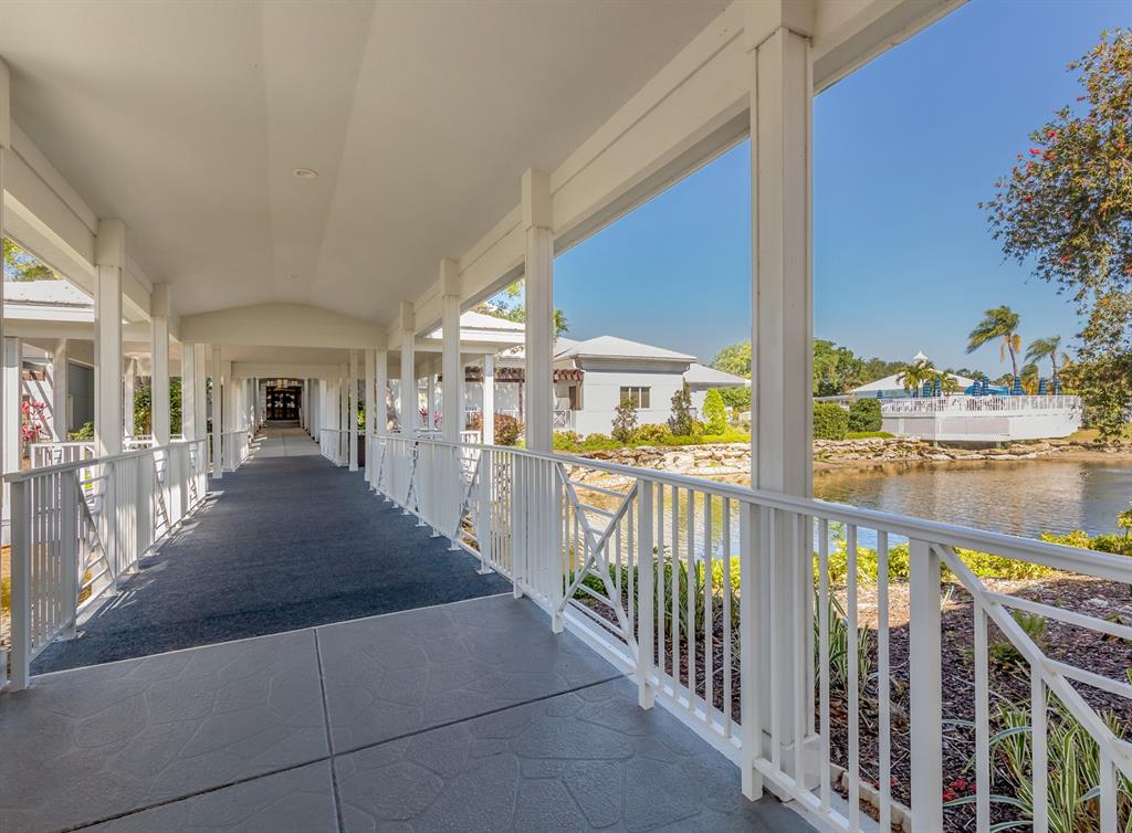 901 Addington Court, Unit 203 Venice, FL 34293 - Photo 53 of 61 a view of a porch with wooden floor