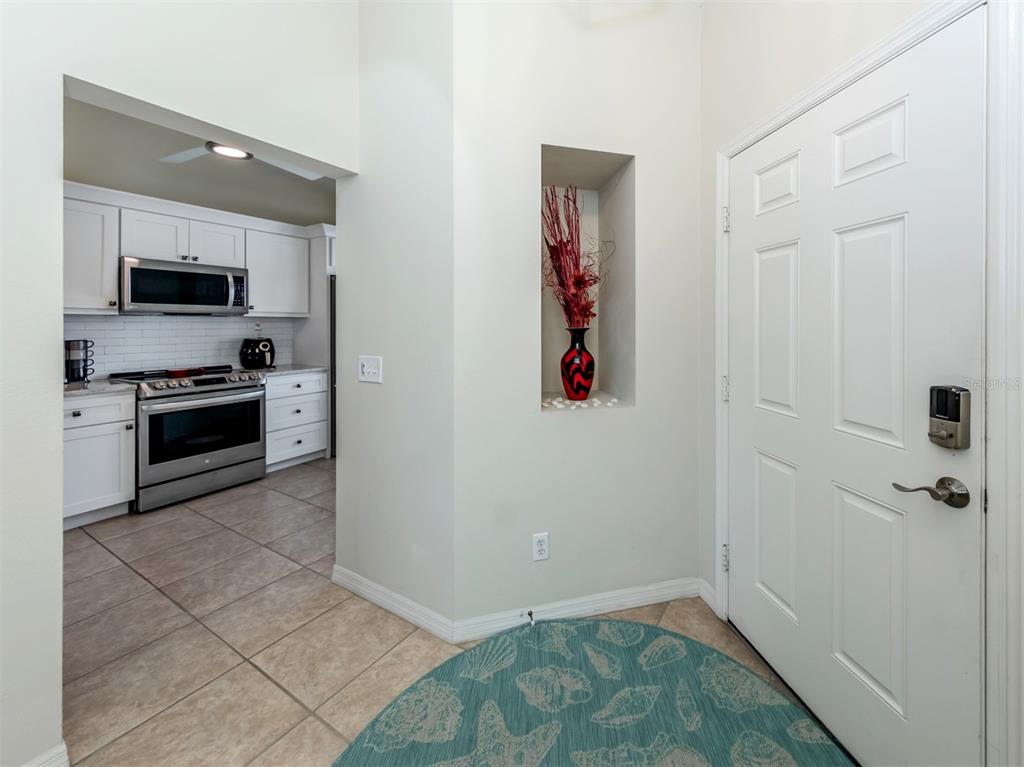 901 Addington Court, Unit 203 Venice, FL 34293 - Photo 6 of 61 a view of a kitchen with a sink