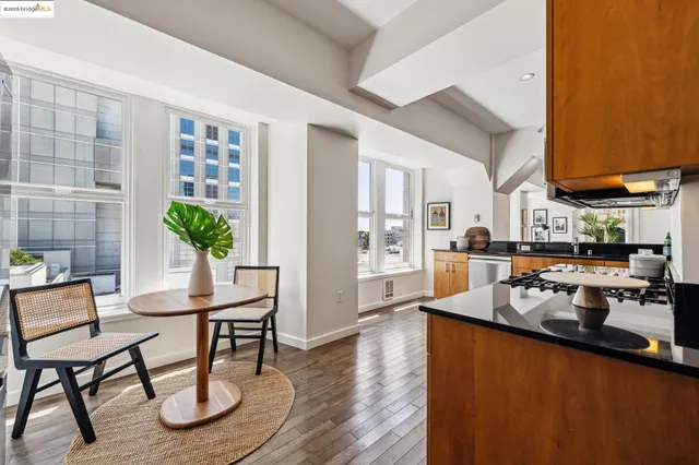 a kitchen with granite countertop a stove top oven and sink