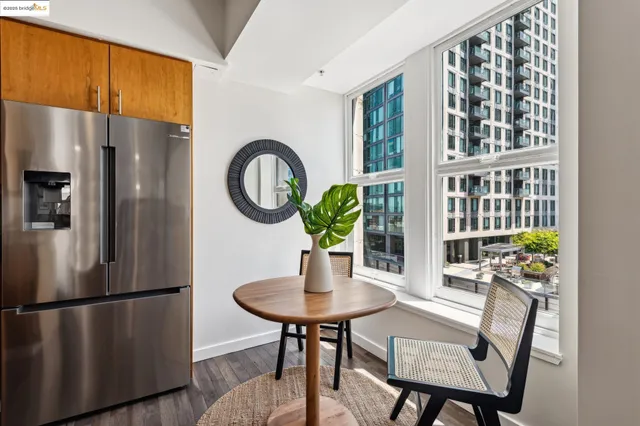 a view of a dining room with furniture and a potted plant