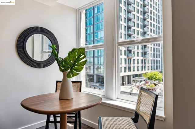 a bedroom with a bed and closet with mirror