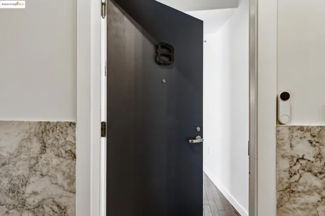 a living room with furniture window and wooden floor