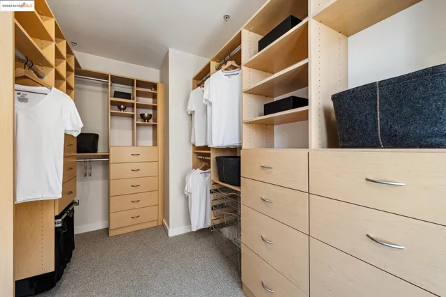 a view of a dining room with a table and chairs
