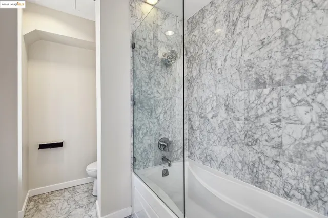 a bedroom with bed and a window