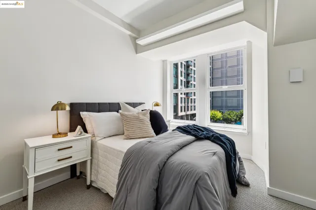 a bedroom with furniture and a window