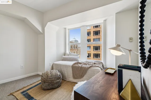 a view of staircase with wooden floor and white walls