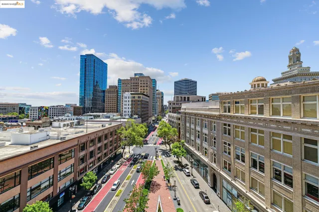 a living room with furniture fireplace and potted plants