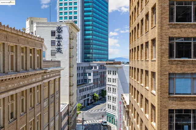 a kitchen with a sink a stove and chairs