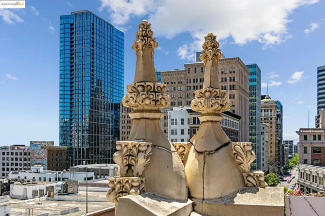 a kitchen with stainless steel appliances kitchen island granite countertop a table chairs in it and a wooden floors