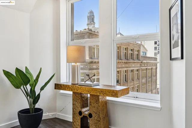 a dining table chairs and a window in a room