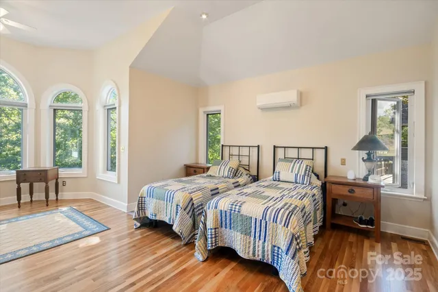 a bedroom with a bed and a table