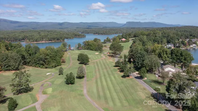 a view of a town with mountains in the background
