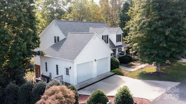 a aerial view of a house with a yard
