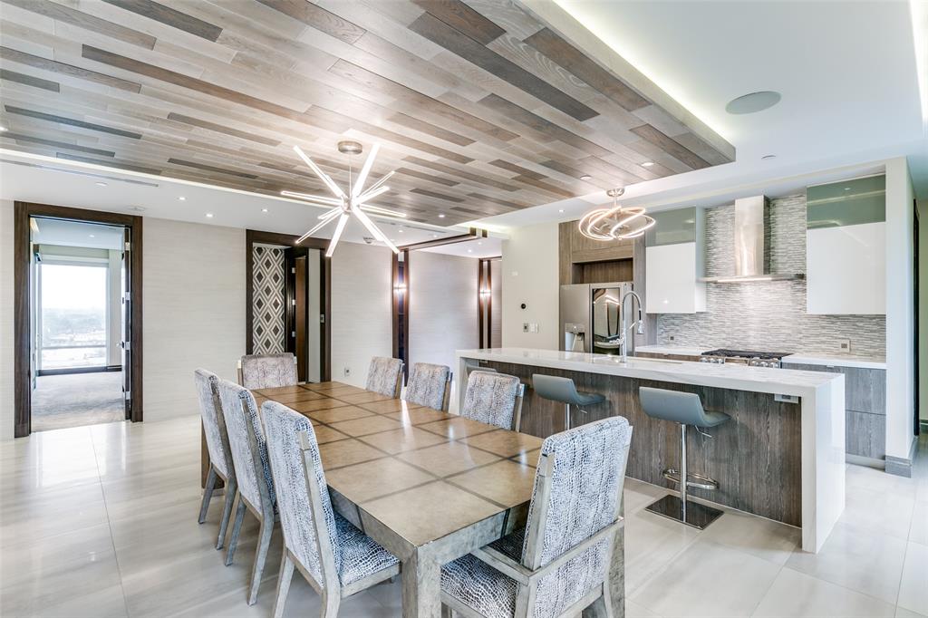 4005 Gaston Avenue, Unit PH2 Dallas, TX 75246 - Photo 10 of 33 Dining space with wooden ceiling and light tile patterned floors