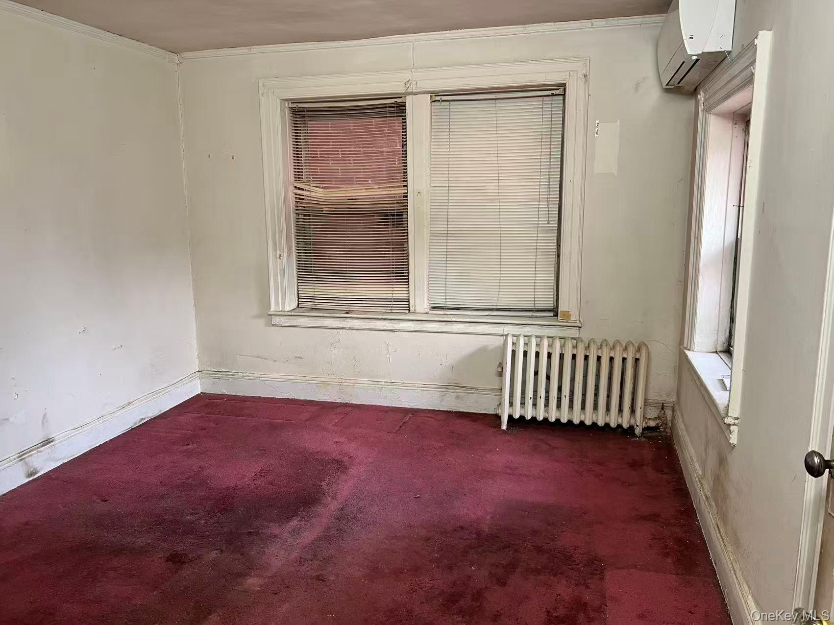 41-31 Hampton Street Queens, NY 11373 - Photo 15 of 23 an empty room with a window