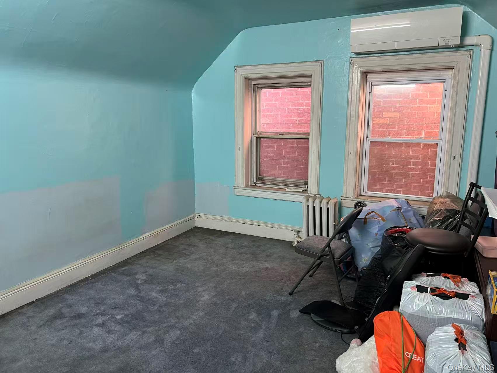 41-31 Hampton Street Queens, NY 11373 - Photo 18 of 23 a room with furniture and a window