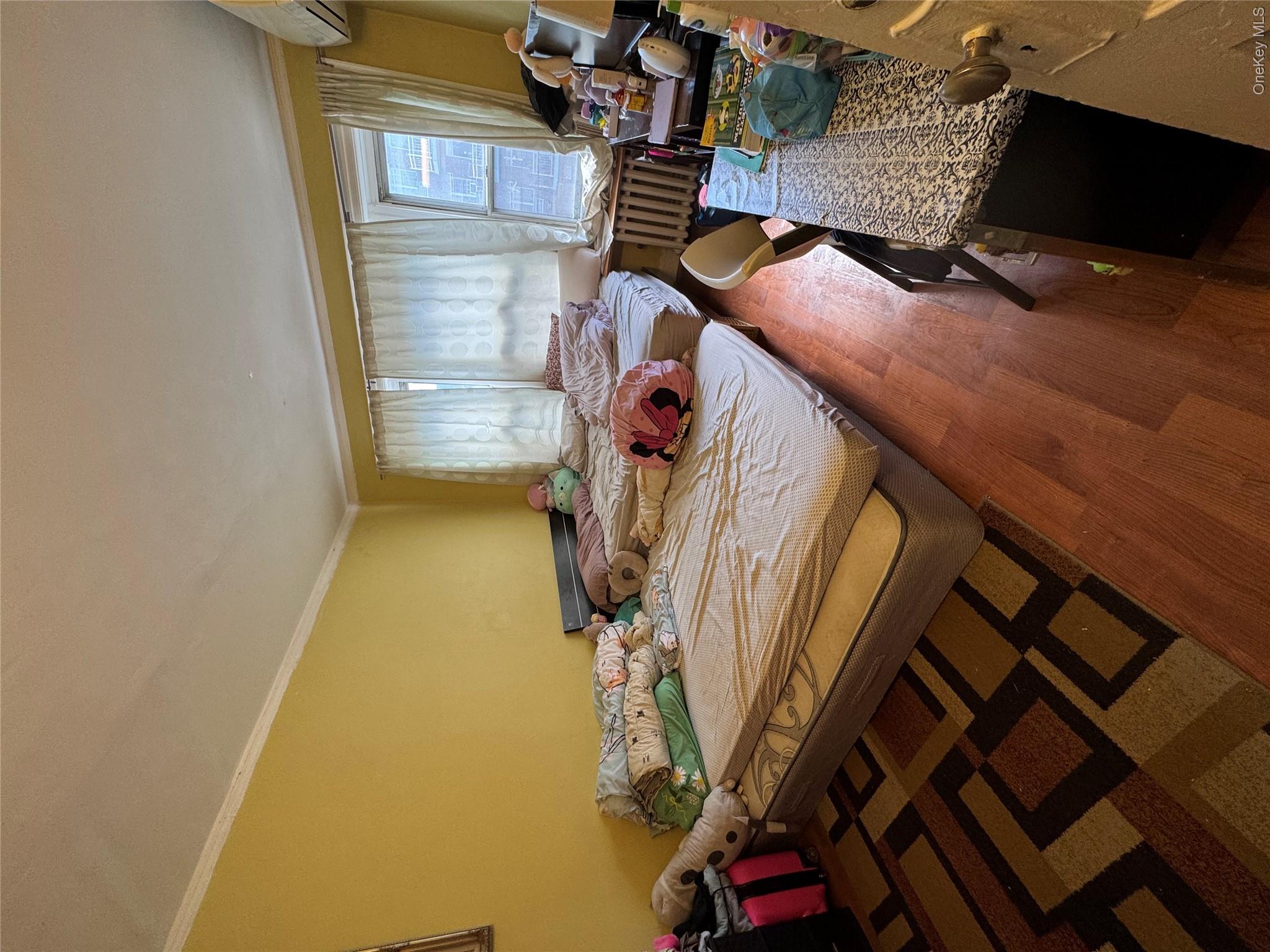 41-31 Hampton Street Queens, NY 11373 - Photo 10 of 23 a living room with hard wood flooring and furniture