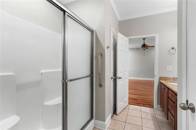 a bathroom with a shower and a sink