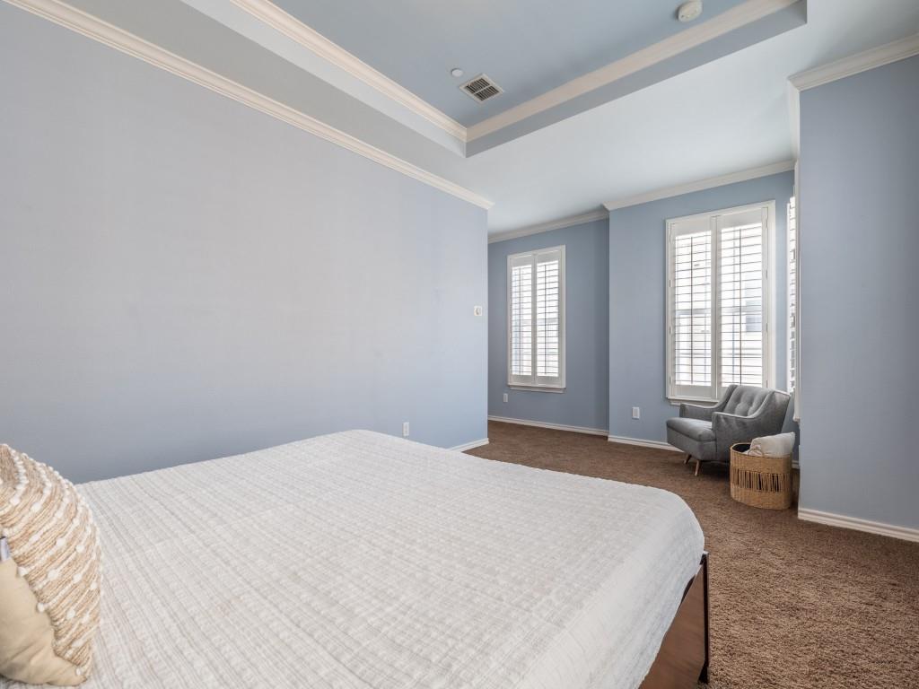 15741 Seabolt Place, Unit 28 Addison, TX 75001 - Photo 14 of 37 Bedroom with ornamental molding, dark colored carpet, and a tray ceiling