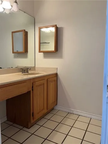 a bathroom with a double vanity sink and mirror