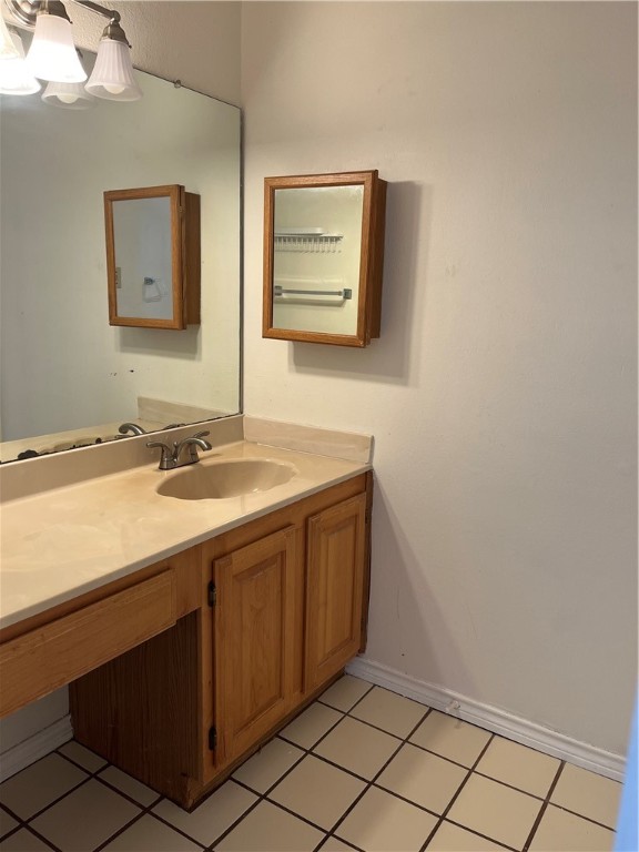 3001 Cedar Street, Unit A214 Austin, TX 78705 - Photo 14 of 17 a bathroom with a sink and a mirror