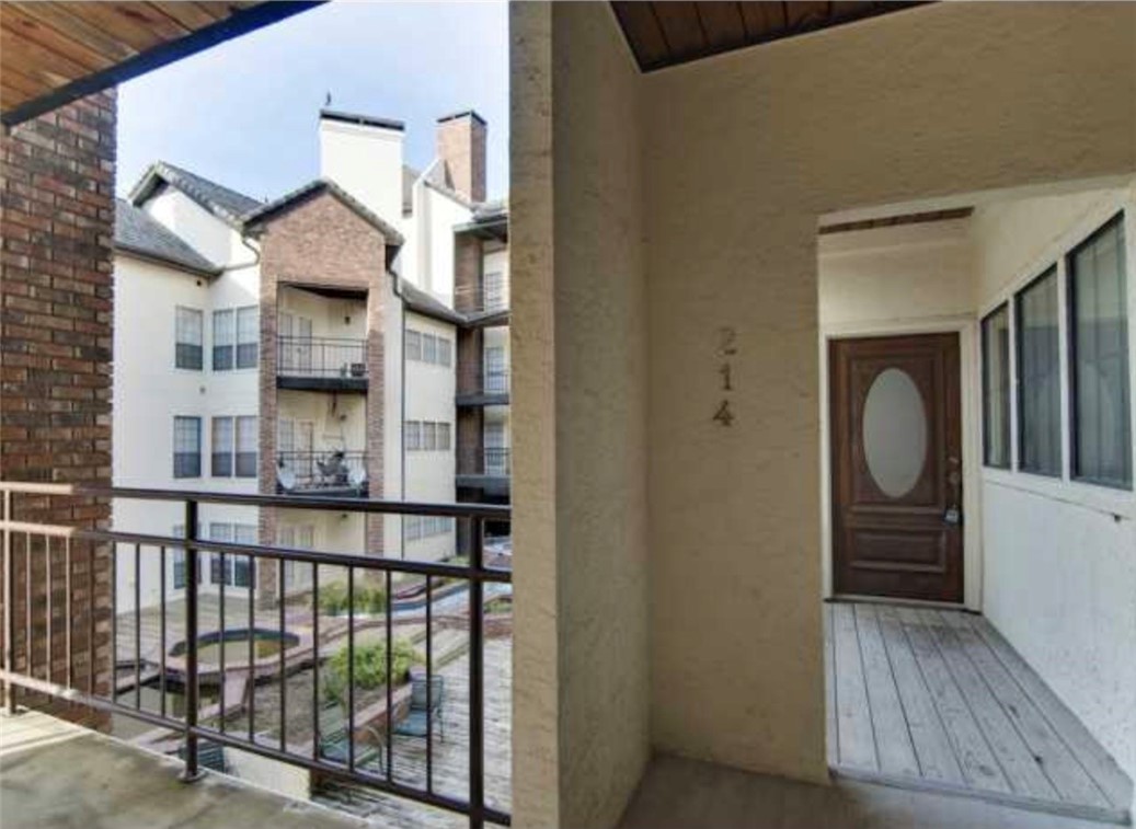 3001 Cedar Street, Unit A214 Austin, TX 78705 - Photo 2 of 17 a view of entryway and hall with wooden floor