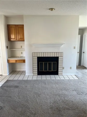 a living room with a fireplace