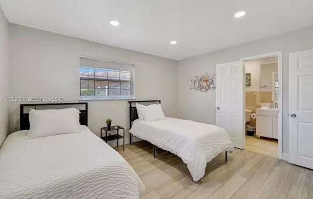 a bedroom with a large bed and a table