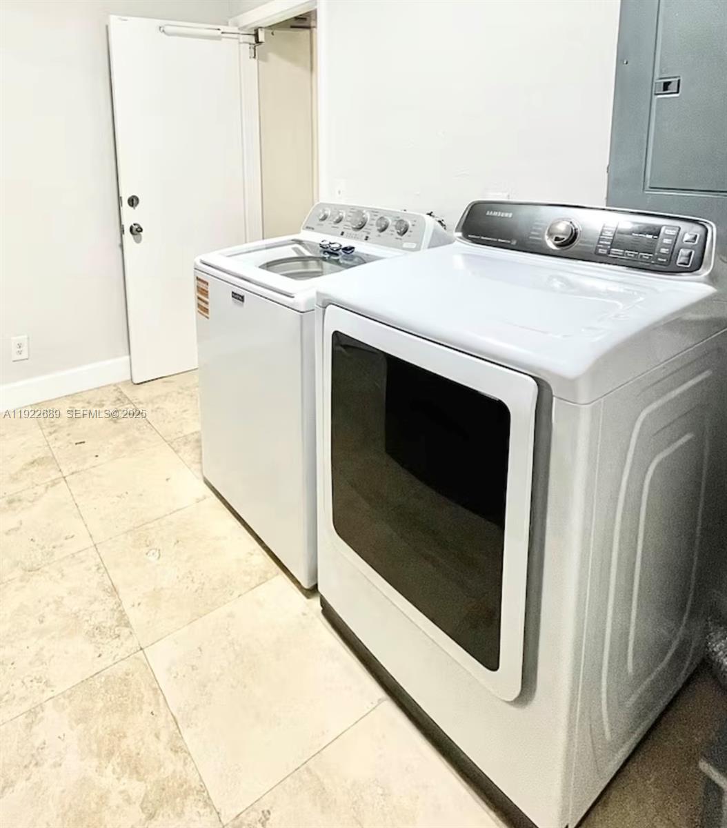 2080 Northeast 205th Street Miami, FL 33179 - Photo 22 of 24 a utility room with washer and dryer