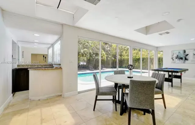 a view of a dining room with furniture window and outside view
