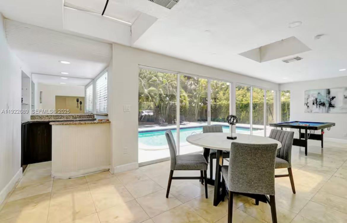 2080 Northeast 205th Street Miami, FL 33179 - Photo 8 of 24 a view of a dining room with furniture window and outside view