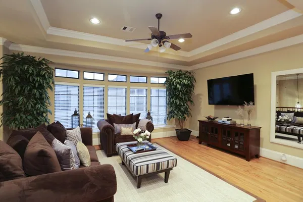 a living room with furniture and a flat screen tv