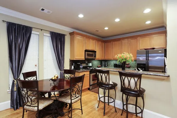 a view of a dining room with furniture window and outside view