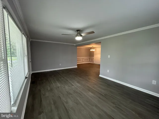 a kitchen with granite countertop a stove and cabinets
