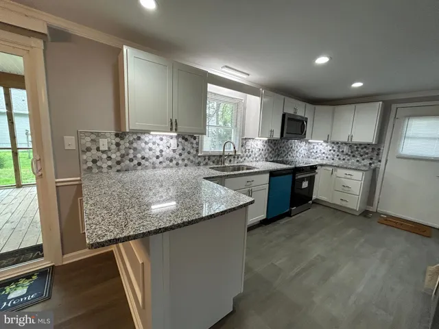 a view of a balcony with wooden floor